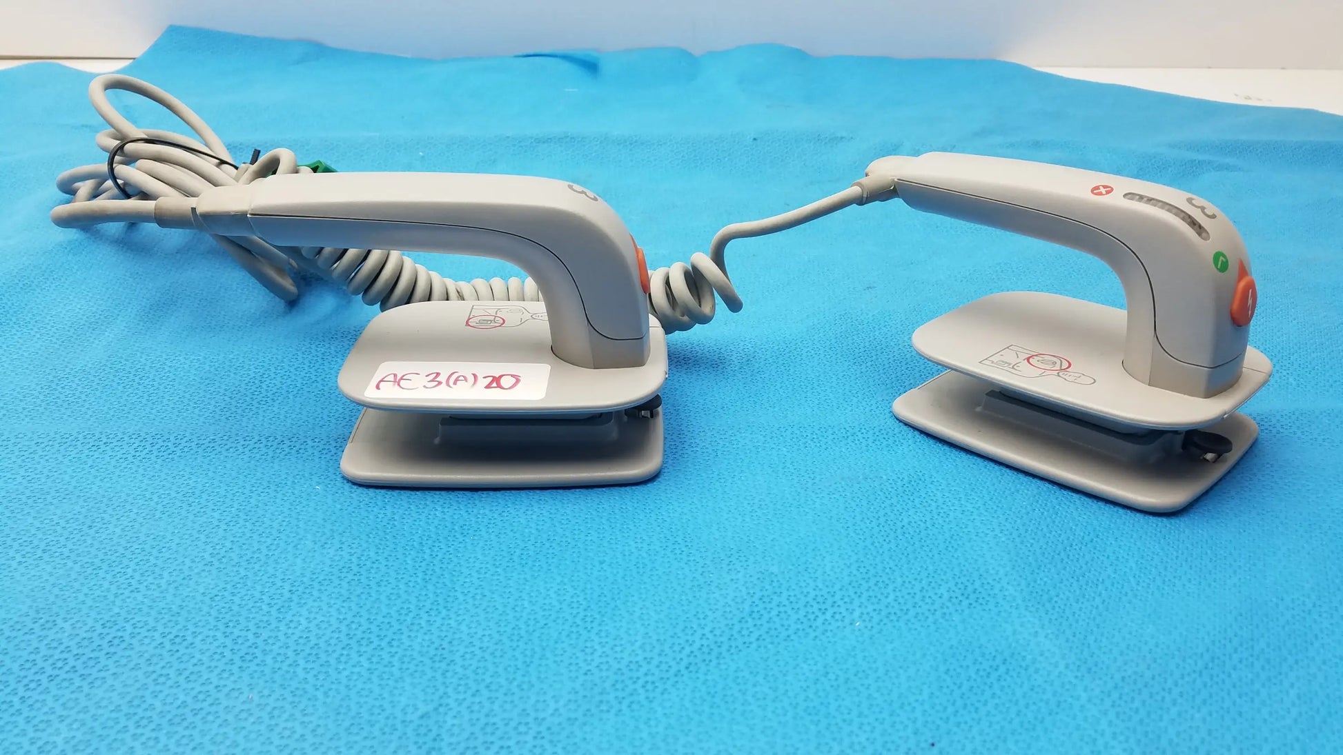 Philips M3543A water resistant gray handheld electric iron with coiled cord and control buttons for medical equipment use