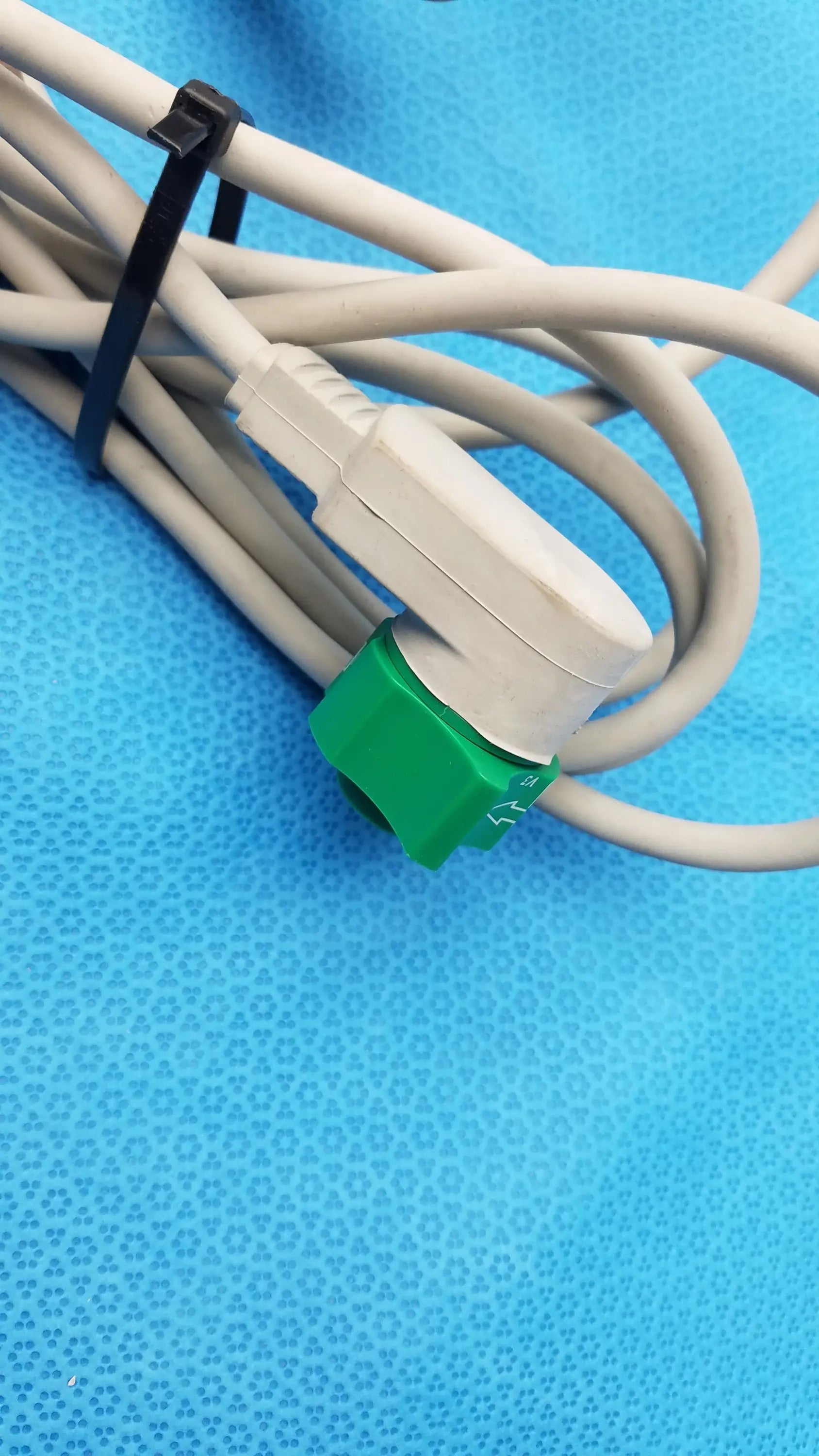 Gray medical cable with white plug and green connector secured by black zip ties for philips m3543a water resistant external hard paddles