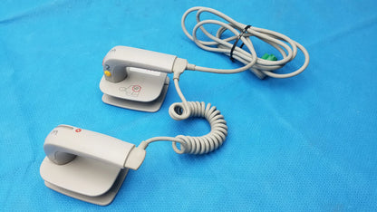 White plastic philips m3543a water resistant ecg electrode clips with coiled cables and green connector for medical equipment