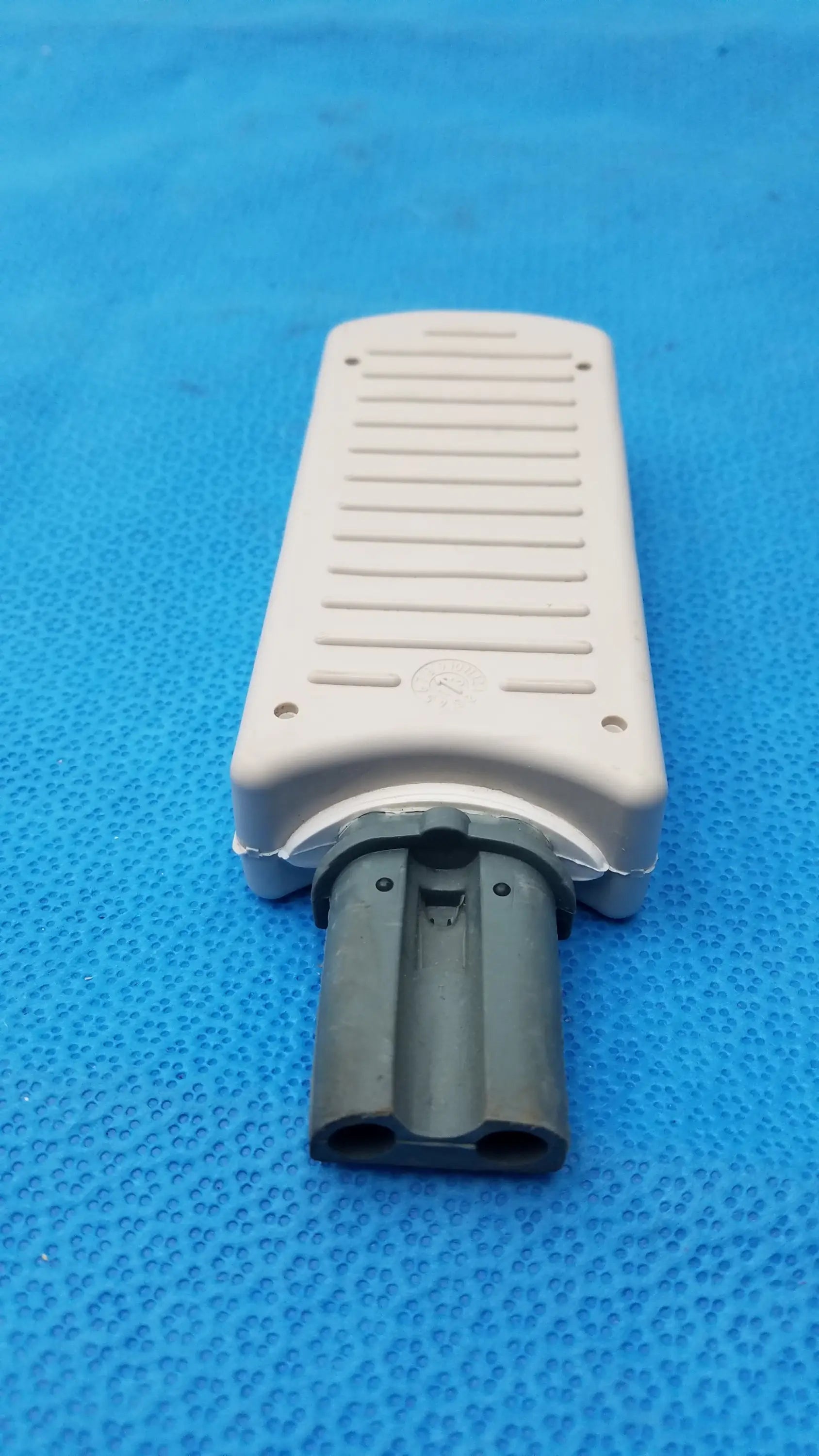 Beige plastic philips m3725a test load with dark gray dual-pronged connector for medical equipment applications