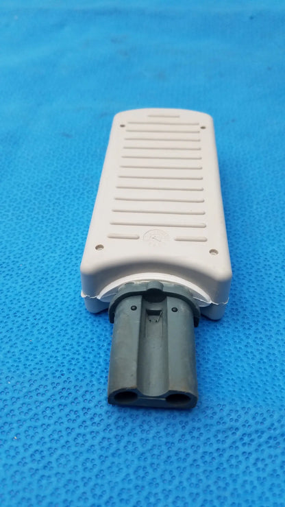 Beige plastic philips m3725a test load with dark gray dual-pronged connector for medical equipment applications