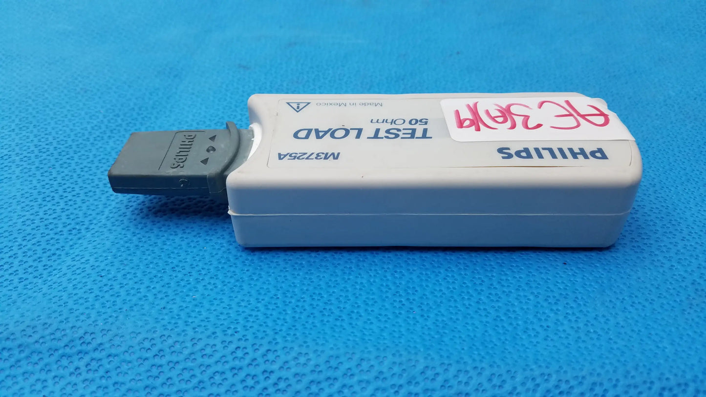 White philips m3725a test load device with gray usb connector and handwritten label used in medical equipment testing