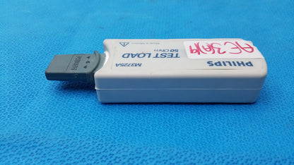 White philips m3725a test load device with gray usb connector and handwritten label used in medical equipment testing