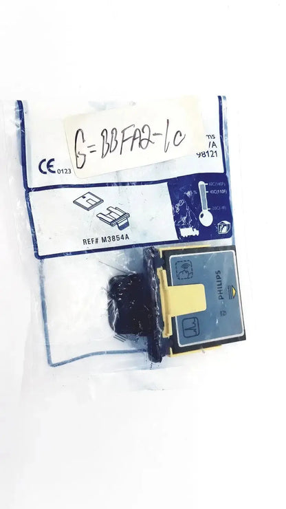 Philips m3854a data card and tray with black and yellow components enclosed in clear plastic packaging for medical use
