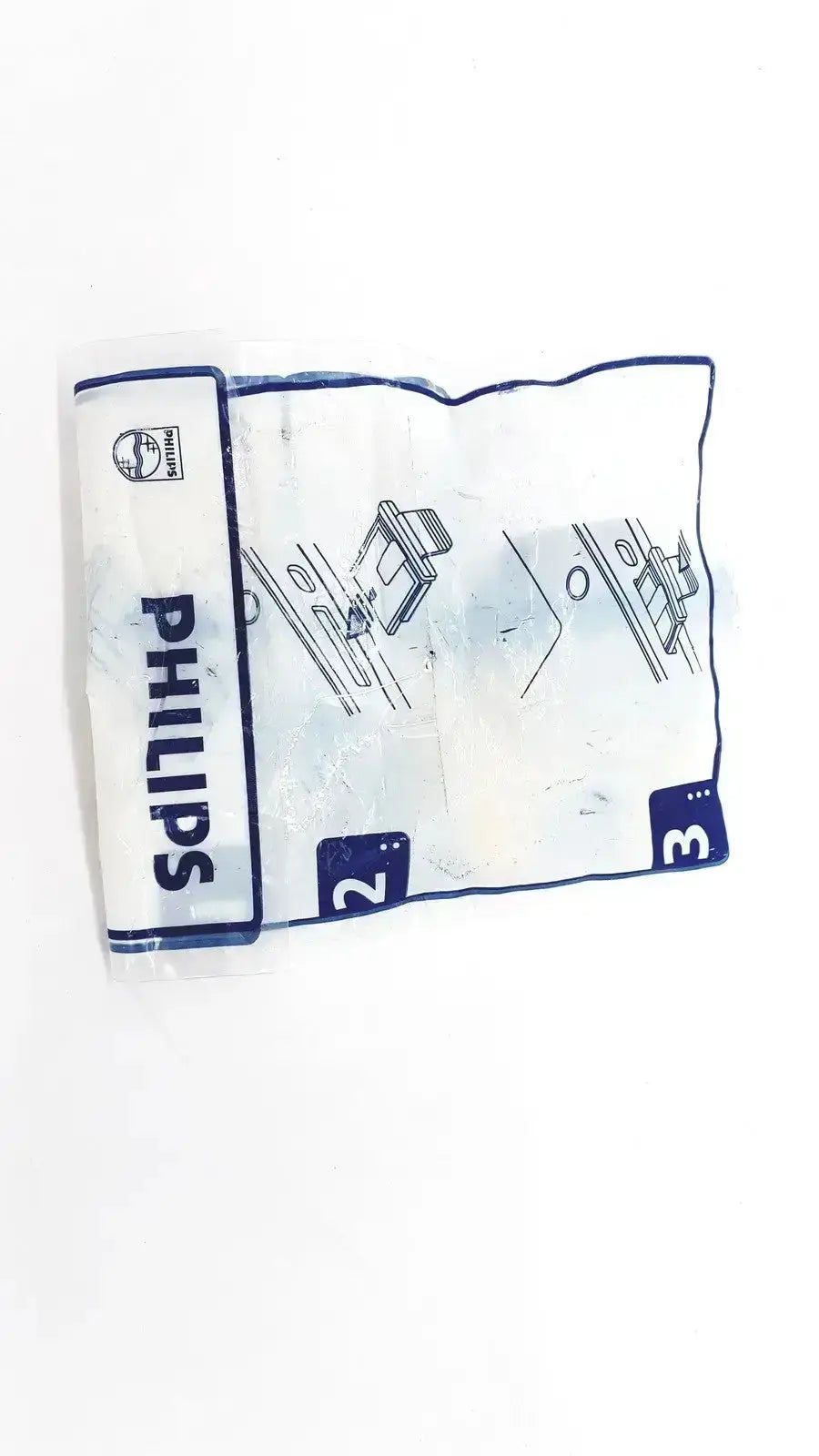 Instruction manual for philips m3854a data card and tray with blue and white printed diagrams on crinkled paper