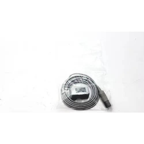 Gray coiled cable with a black rectangular connector and a metallic plug end, packaged in clear plastic