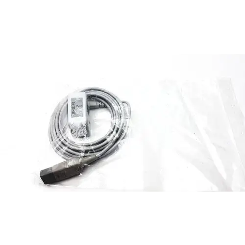 Philips cordless phone handset with coiled gray cable and black base unit, packaged in clear plastic.