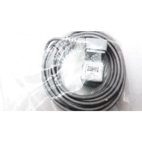 Gray coiled cable with a gray rectangular connector and barcode label wrapped in clear plastic packaging