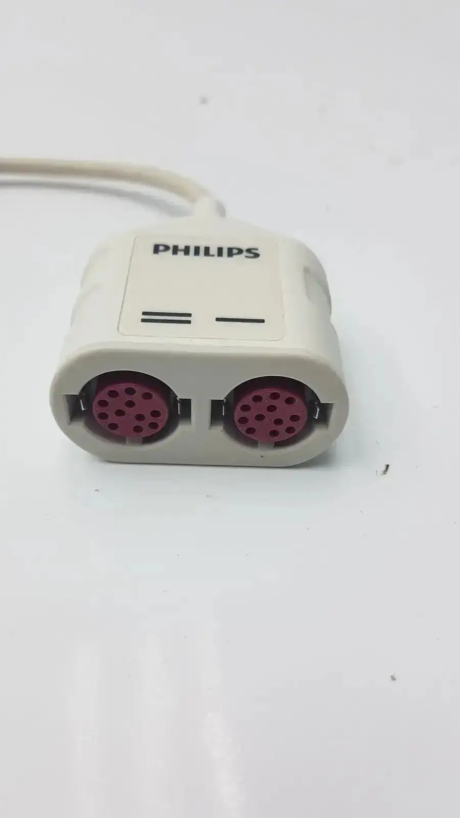 White Philips REF dual invasive blood pressure adapter cable with two pink circular connectors for IBP monitoring