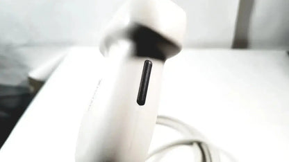 White handheld Philips X6-1 Matrix Array ultrasound transducer probe with black rectangular vent on its side