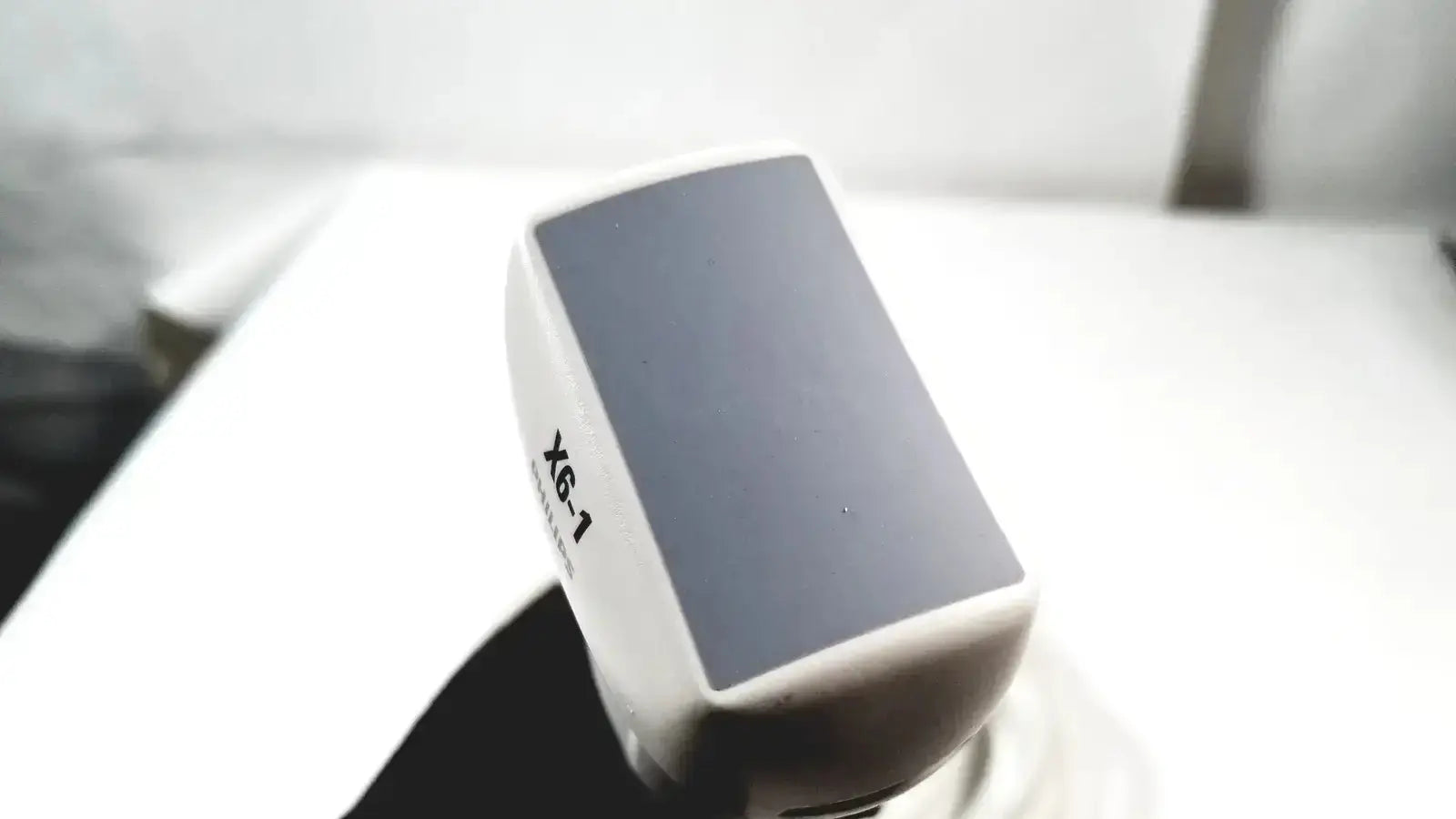 White philips x6-1 matrix array ultrasound transducer probe with dark gray screen and printed model number on side
