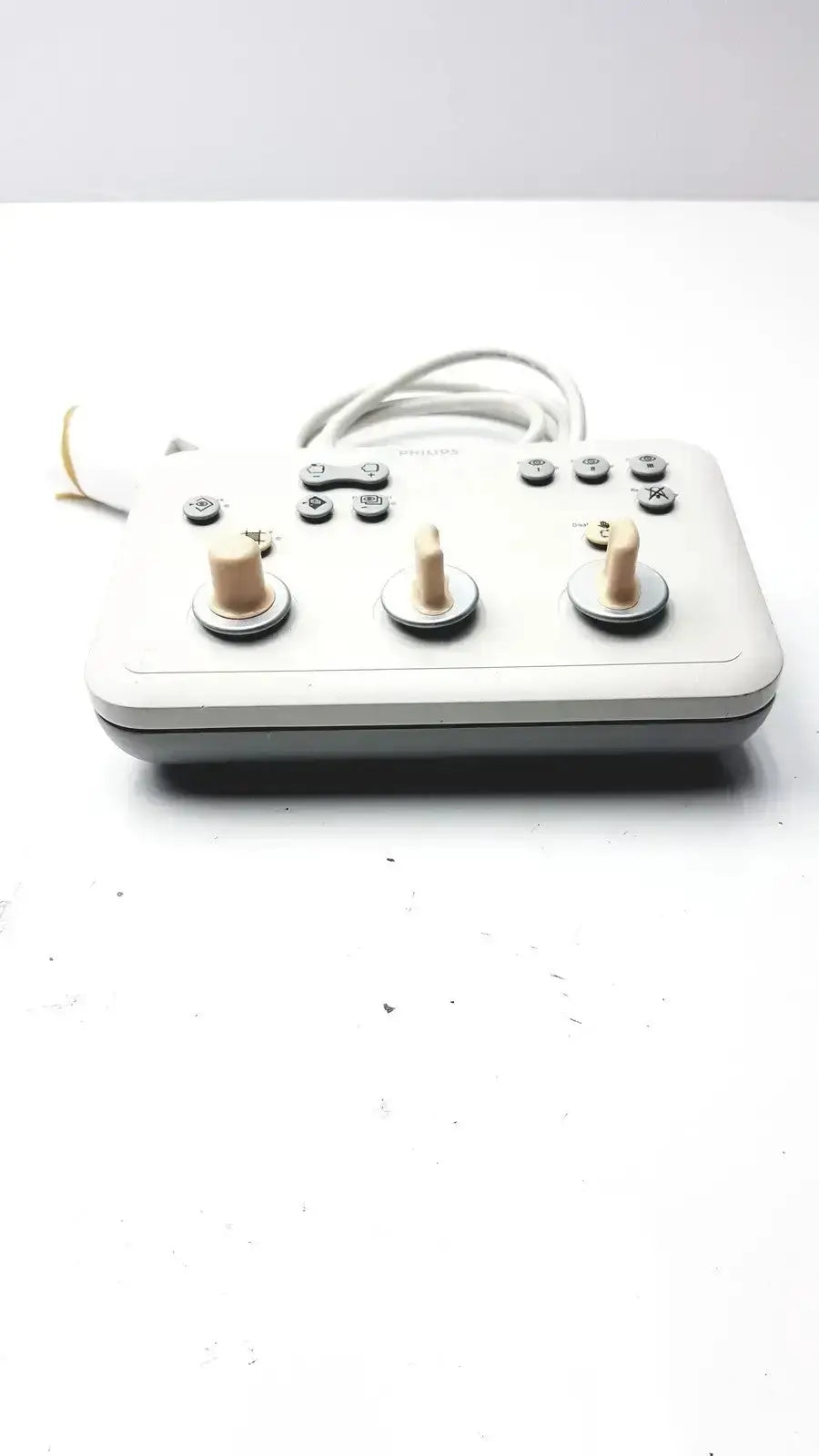 White plastic Phillips operator imaging module mono c controller with three beige knobs and multiple buttons