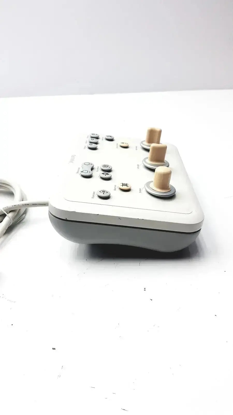 Gray and beige Phillips operator imaging module mono c controller with three wooden knobs, buttons, and coiled cable