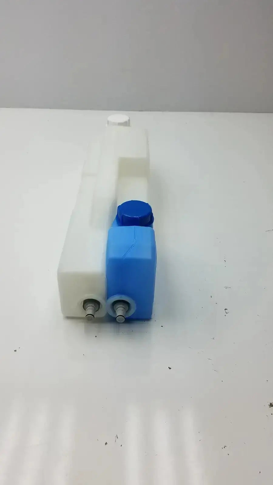 Plastic universal tank with two blue caps featuring blue and white dual-bottle plastic water dispenser design