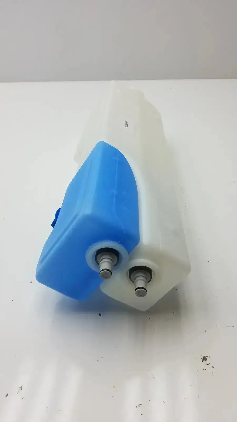 Blue and white plastic universal tank with two metal caps made of durable plastic universal coolant reservoir