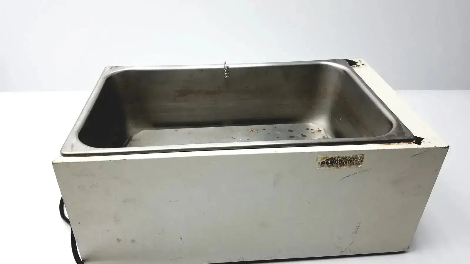 Stainless steel rectangular ultrasonic cleaner with white plastic base and wear edges in precision 51221050 water bath for pre owned medical equipment sale