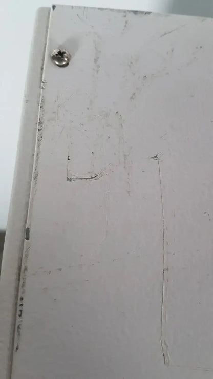 White slightly worn wooden cabinet door with visible screw on napco precision series 5425 co2 incubator