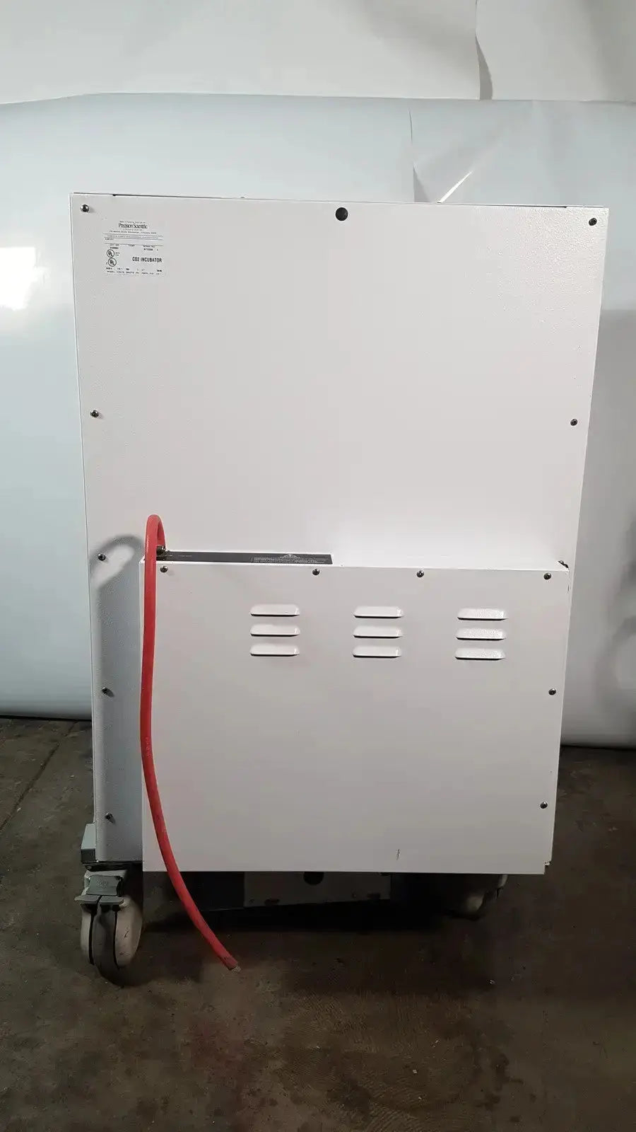 White industrial-grade napco precision series co2 incubator with red hose and casters for mobility model 5425 ot-100z