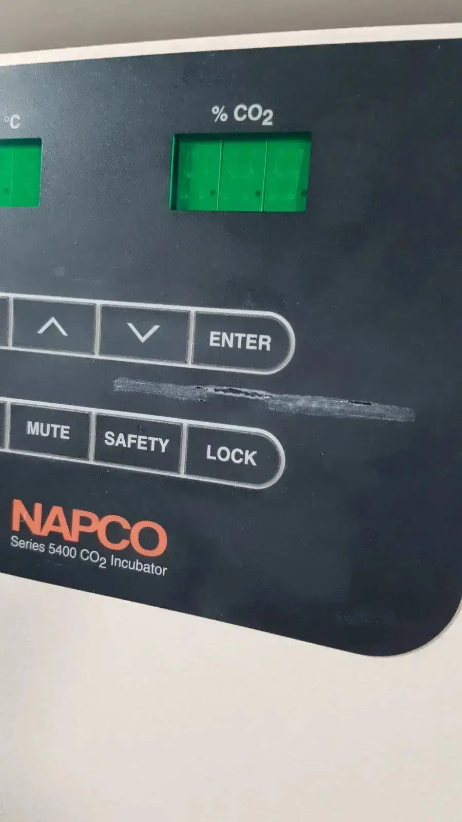 Black control panel of napco precision series 5425 co2 incubator with green digital displays and labeled white buttons