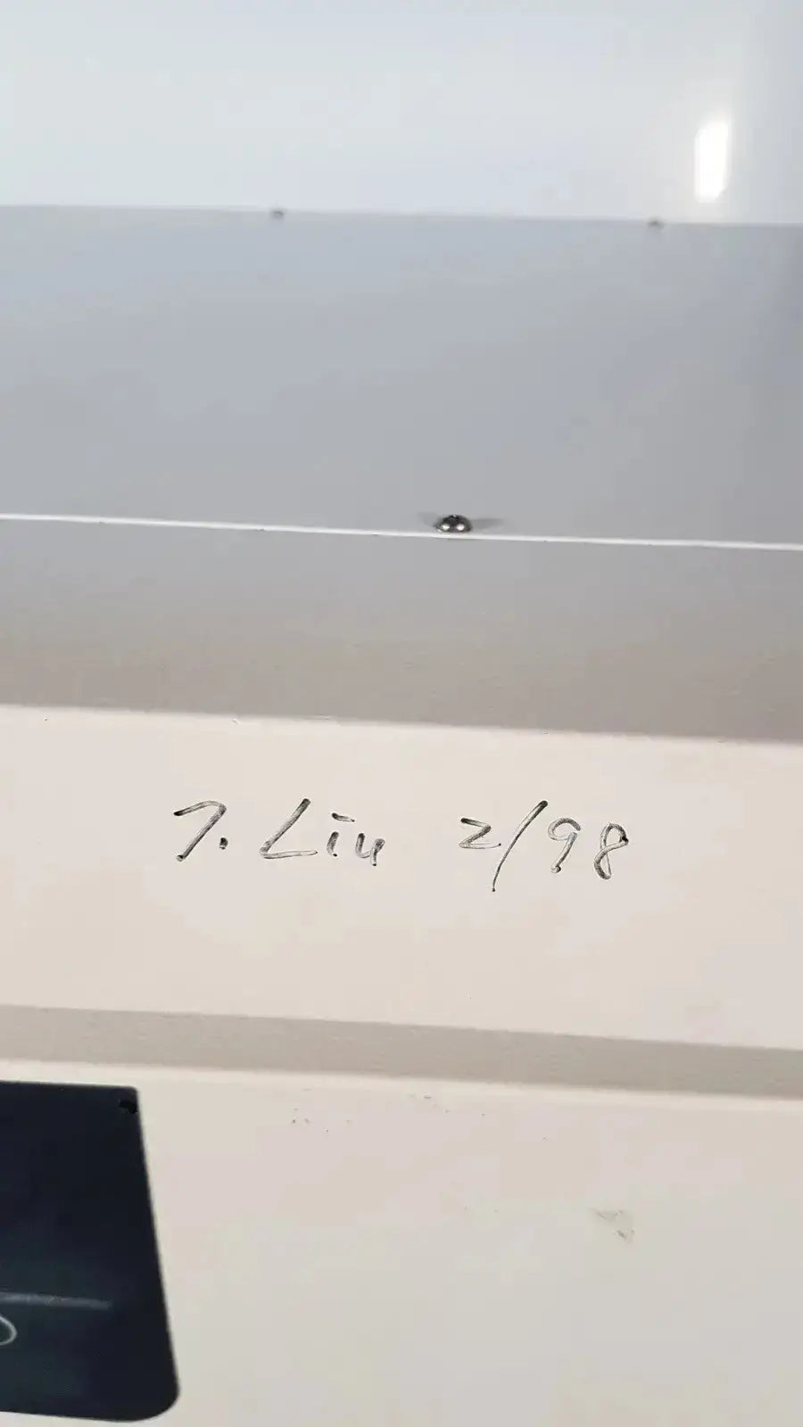A white rectangular label with black handwritten text on the back of a napco precision series co2 incubator model 5425