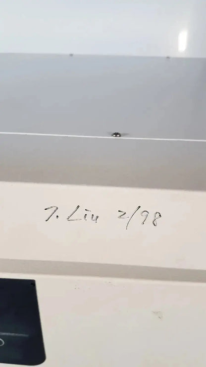 A white rectangular label with black handwritten text on the back of a napco precision series co2 incubator model 5425