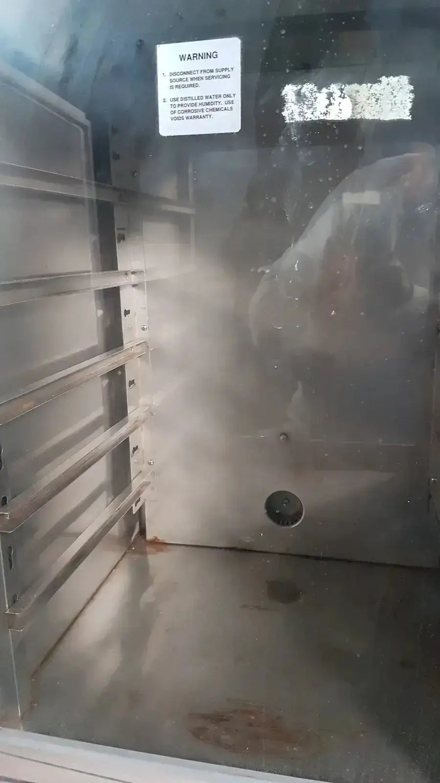 Stainless steel napco precision series co2 incubator model 5425 with interior racks and warning label for laboratory use