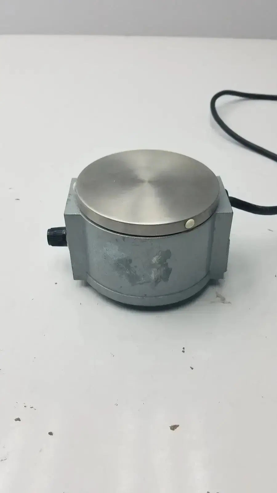 Gray industrial load cell with brushed stainless steel top plate and black cord for precision scientific mag-mix 60647