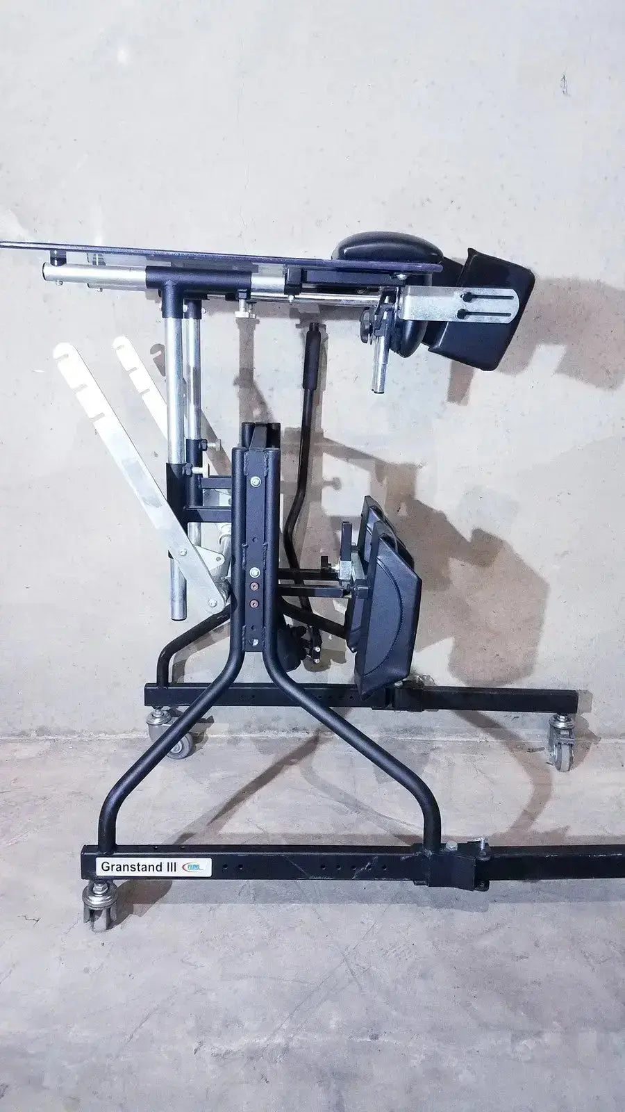 Black metal grandstand iii modular standing system with adjustable components and caster wheels for mobility