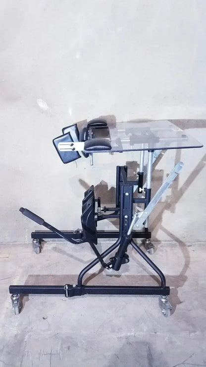 Black metal therapy table with adjustable height and clear acrylic top from prime engineering grandstand iii modular standing system