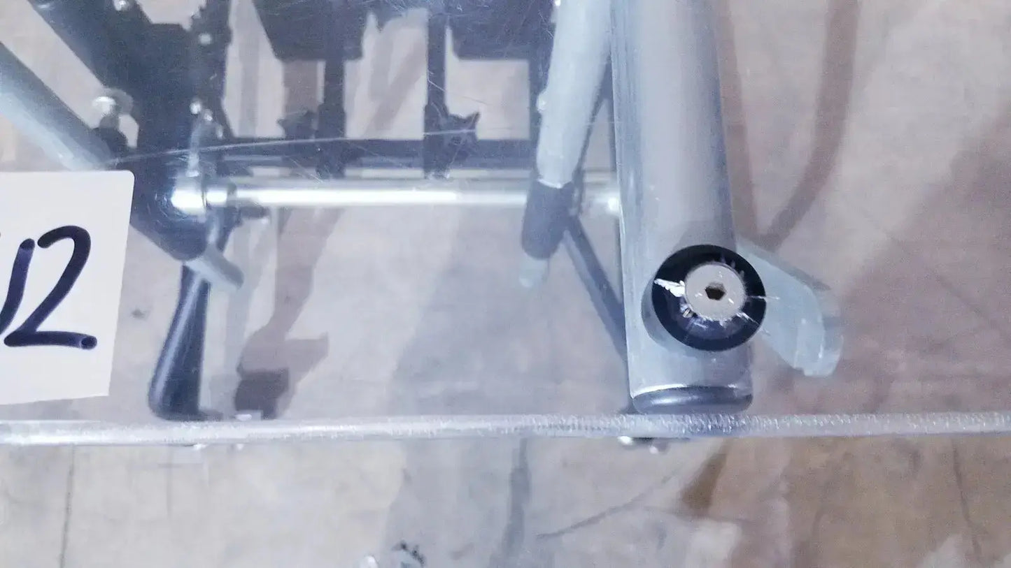 Silver metallic bicycle stand with black rubber grip and circular knob in prime engineering grandstand iii modular standing system
