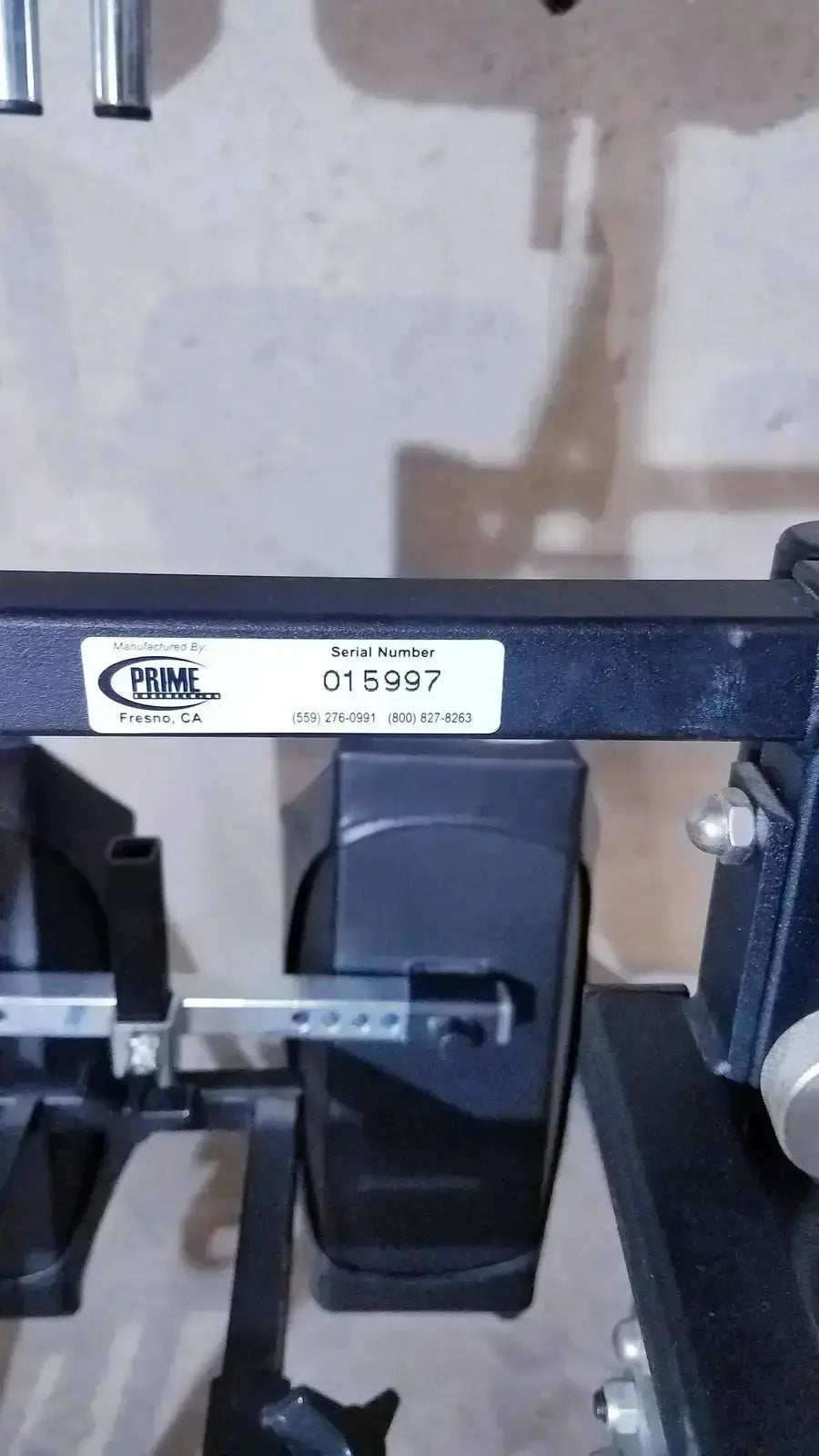 Black metal industrial scale with prime label and serial number 015997 for grandstand iii modular standing system