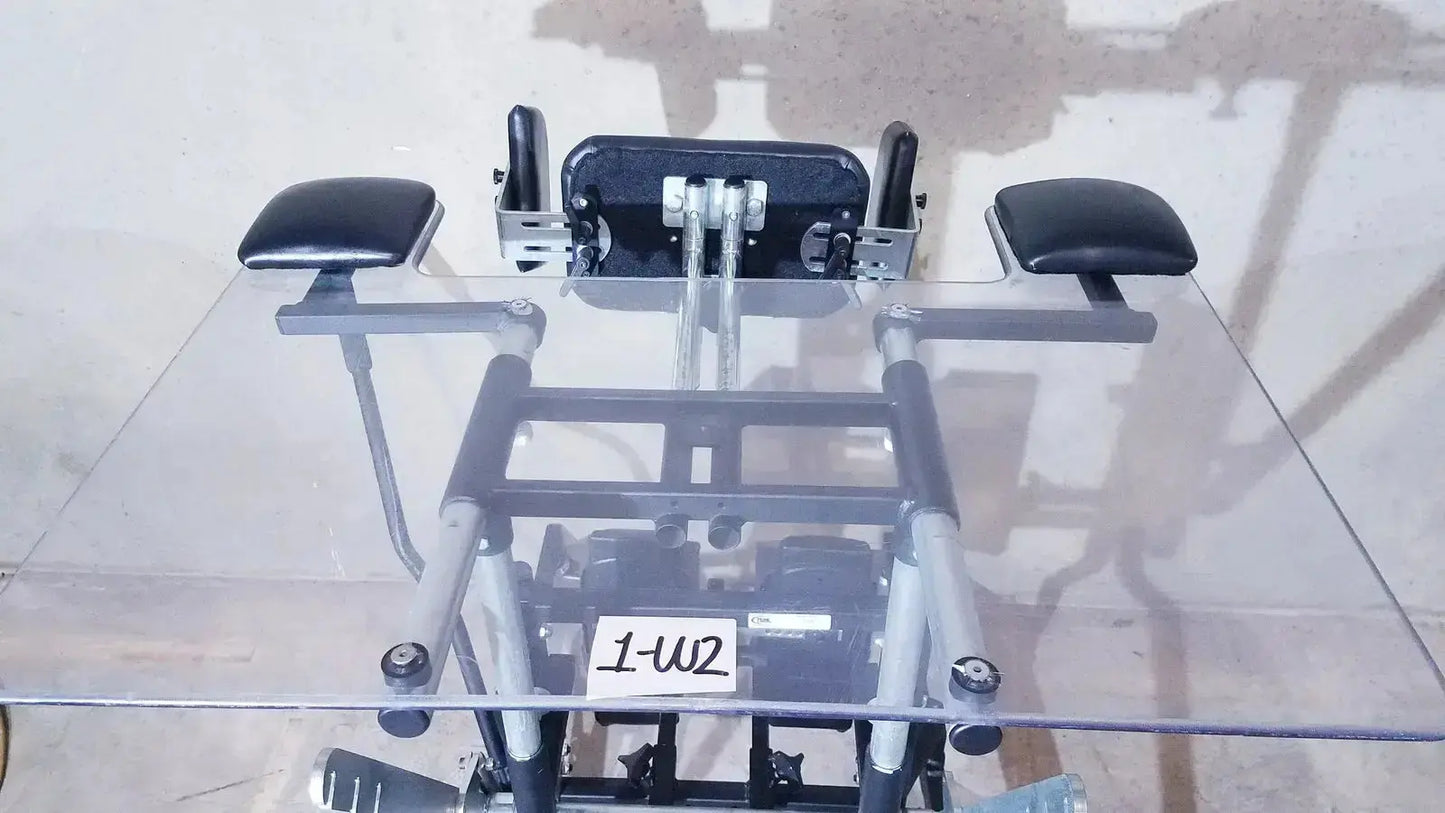 Prime Engineering grandstand iii modular standing system black and silver metal wheelchair with padded armrests