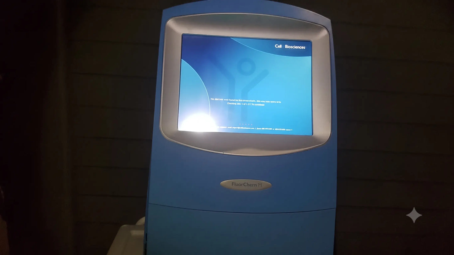 Blue plastic ProteinSimple FluorChem M fluorescent western blot imaging system with touchscreen showing cell sciences logo