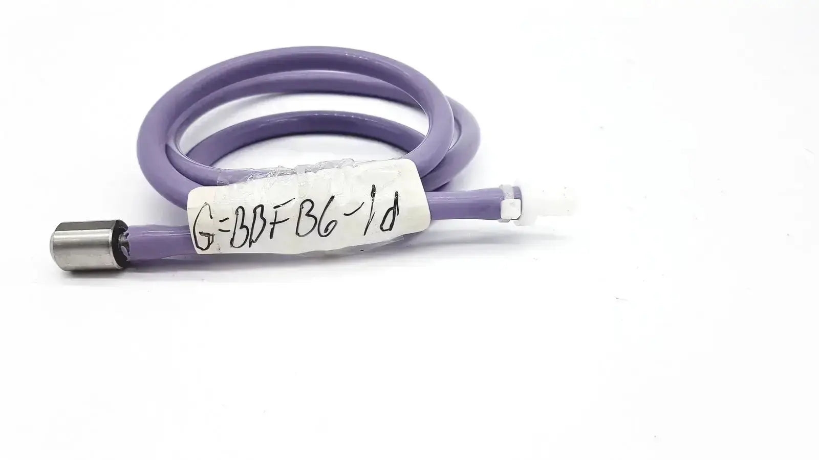 Purple color pressure water mini coiled pipe with one side metal connector and plastic material featuring a white label