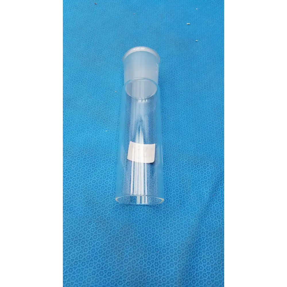 Clear plastic cylindrical container with a frosted white cap and a small rectangular label affixed to its side.