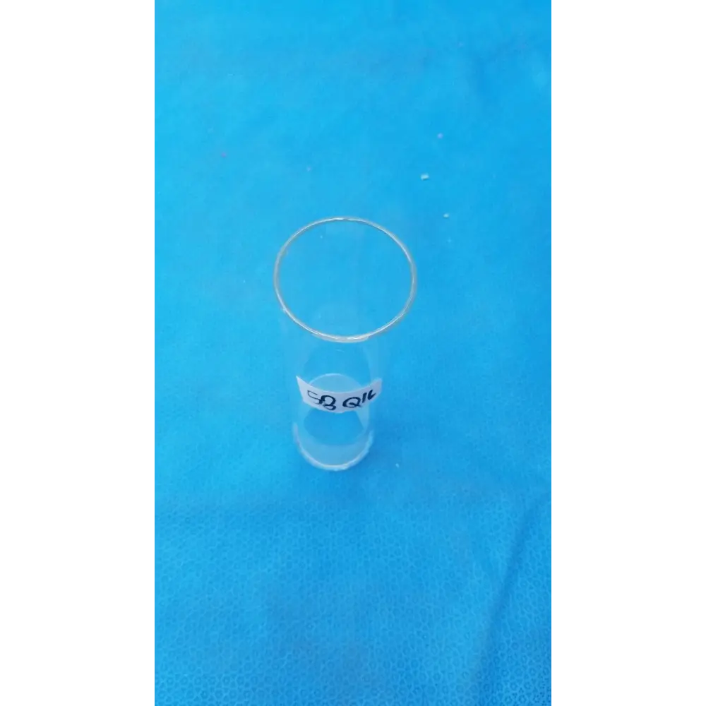Clear glass test tube with a white label bearing black text.