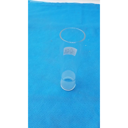 Clear glass graduated cylinder with a white label bearing thai script.