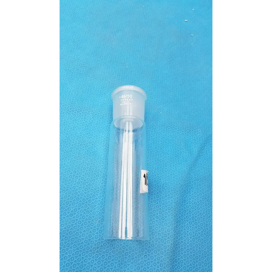 Clear plastic vial with a white cap and multiple thin, transparent needles inside.