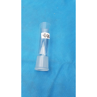 Clear plastic tube with a white label reading ’58 qil’ and containing several thin, transparent needles.