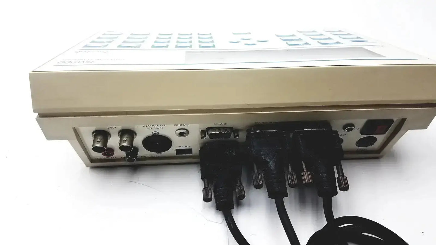 Beige radiometer copenhagen tim900 titration manager rear panel with multiple black cables connected to ports