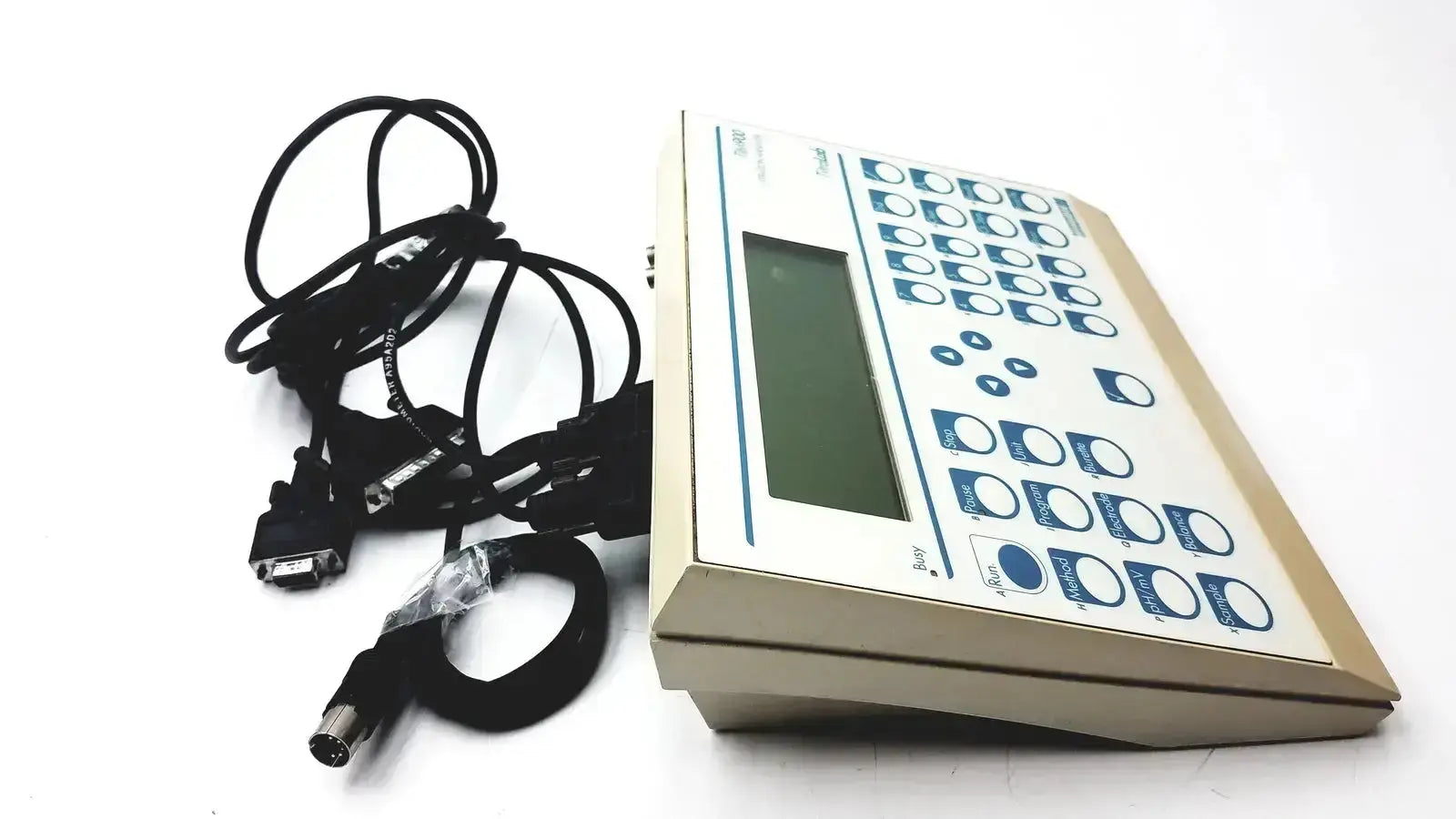 Beige radiometer copenhagen tim900 titration manager with rectangular screen blue-labeled buttons and coiled black cables