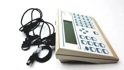Beige radiometer copenhagen tim900 titration manager with rectangular screen blue-labeled buttons and coiled black cables