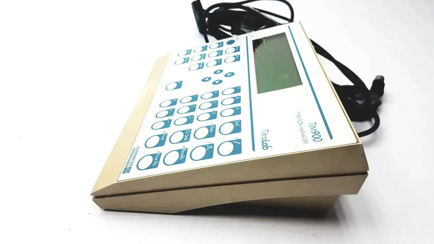 Beige plastic radiometer copenhagen tim900 titration manager with rectangular display and blue-labeled buttons for precise analysis