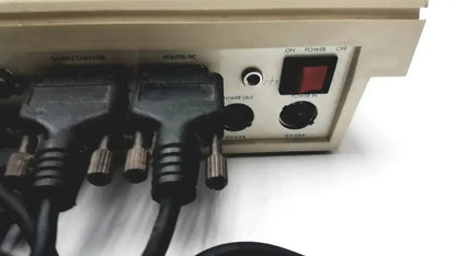 Beige radiometer copenhagen tim900 titration manager rear panel with black power cables and red on power off switch