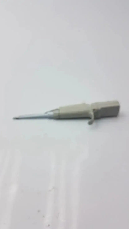Gray plastic-handled screwdriver with metallic shaft used for maintenance of Rainin EDP3 Plus electronic digital pipette calibrated device