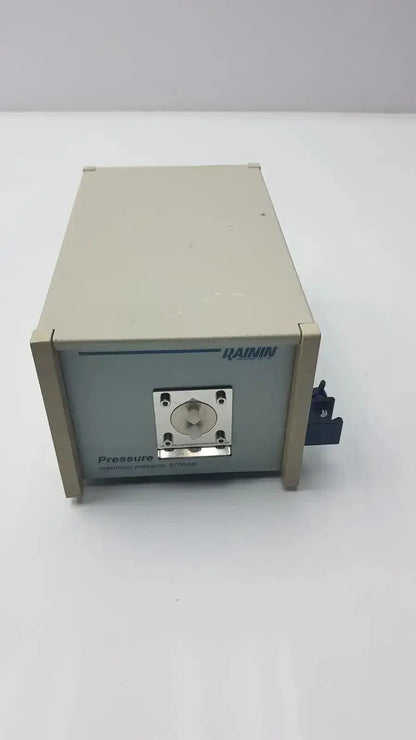 Beige and gray rainin hplc pressure module 8700 psi box with metallic port and black switch model g-bbda5-28r