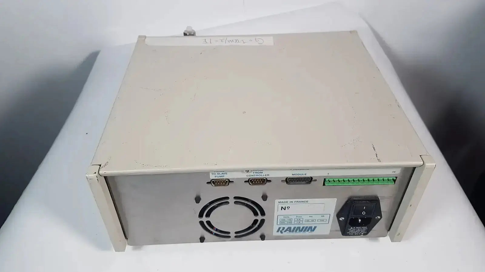 Beige metal industrial power supply unit with multiple serial ports and green terminal strip for rainin hpxl solvent delivery system