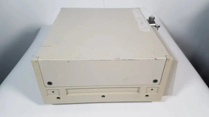 Beige metal file cabinet with lock and wear marks for secure storage in rainin hpxl solvent delivery system