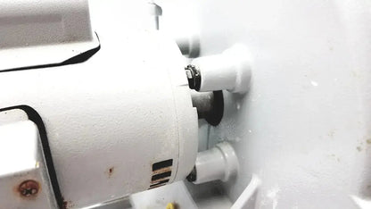 White industrial motor with black bolts and ventilation slots on the Ray Foster MT12 dental lab model trimmer