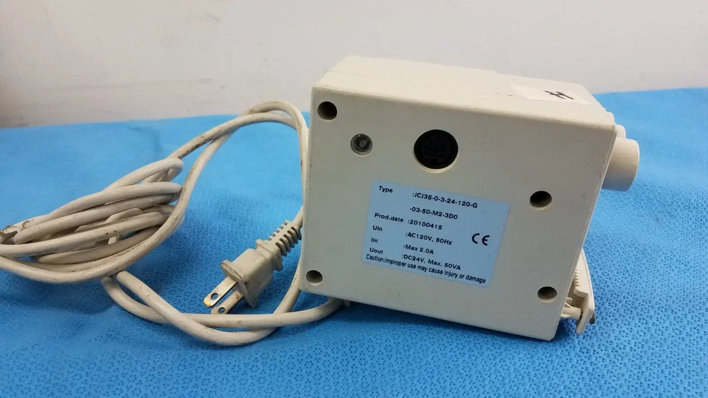 White rectangular raydow rd-b-24 multi-function control box with coiled beige cord for reuse medical equipment use